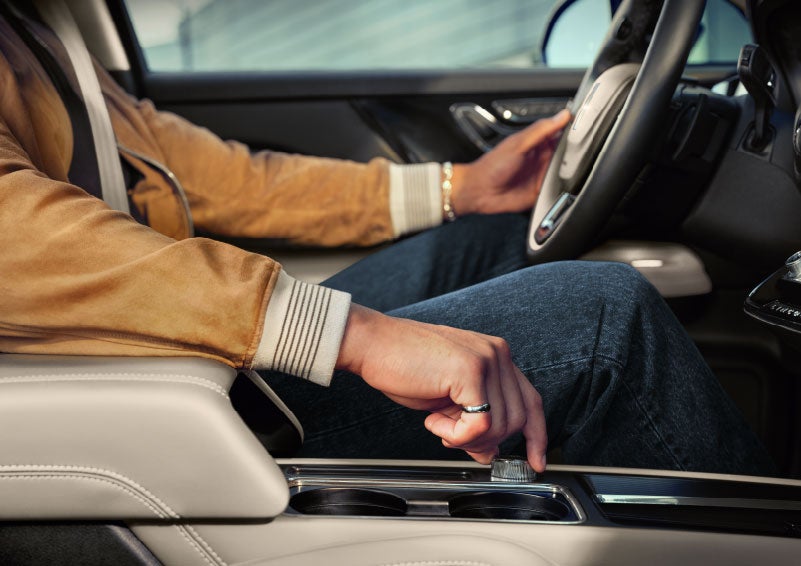 The driver of a 2024 Lincoln Corsair® SUV is shown selecting the drive mode. | Parks Lincoln of Wesley Chapel in Wesley Chapel FL