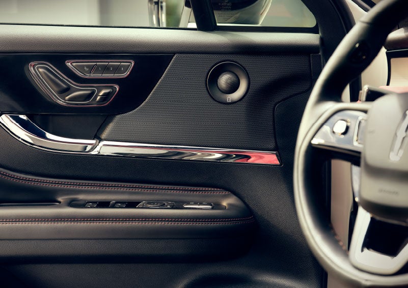 An audio speaker is shown in the driver's side door of a 2024 Lincoln Corsair® SUV. | Parks Lincoln of Wesley Chapel in Wesley Chapel FL