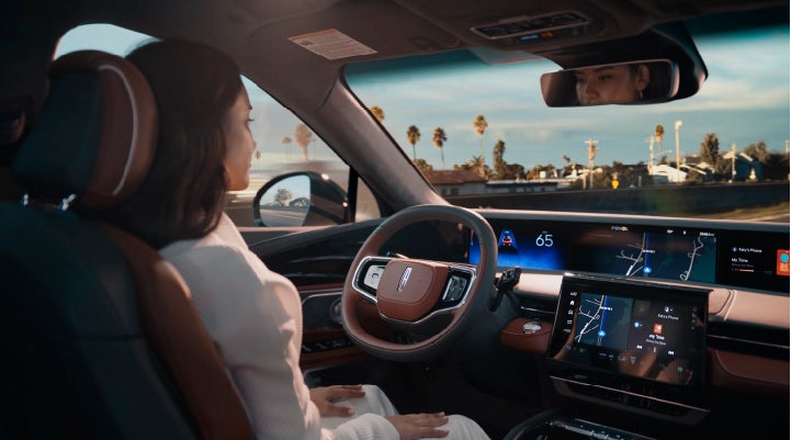 A person is shown driving hands-free on the highway with available Lincoln BlueCruise technology. | Parks Lincoln of Wesley Chapel in Wesley Chapel FL