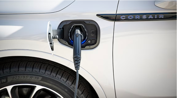 An electric charger is shown plugged into the charging port of a Lincoln Corsair® Grand Touring
model. | Parks Lincoln of Wesley Chapel in Wesley Chapel FL