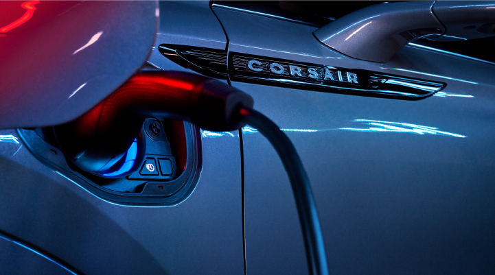 A charger plugged into the charging port of a 2025 Lincoln Corsair® Plug-in Hybrid model. | Parks Lincoln of Wesley Chapel in Wesley Chapel FL