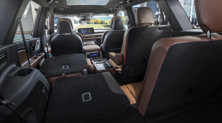 One side of the PowerFold® third-row seat and a second-row seat are folded forward in the 2026 Lincoln Aviator® SUV. | Parks Lincoln of Wesley Chapel in Wesley Chapel FL