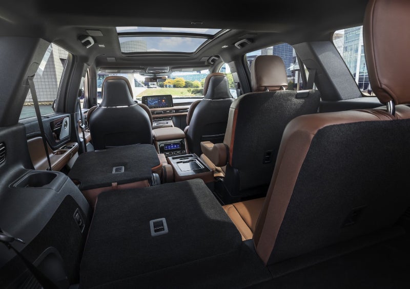 One side of the PowerFold® third-row seat and a second-row seat are folded forward in the 2026 Lincoln Aviator® SUV. | Parks Lincoln of Wesley Chapel in Wesley Chapel FL