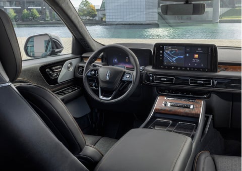 The interior of the 2026 Lincoln Aviator® SUV is shown parked with a view of a harbor through the windshield. | Parks Lincoln of Wesley Chapel in Wesley Chapel FL