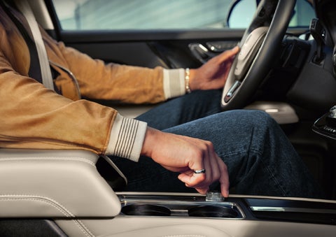 The driver of a 2026 Lincoln Corsair® SUV is shown selecting a drive mode. | Parks Lincoln of Wesley Chapel in Wesley Chapel FL