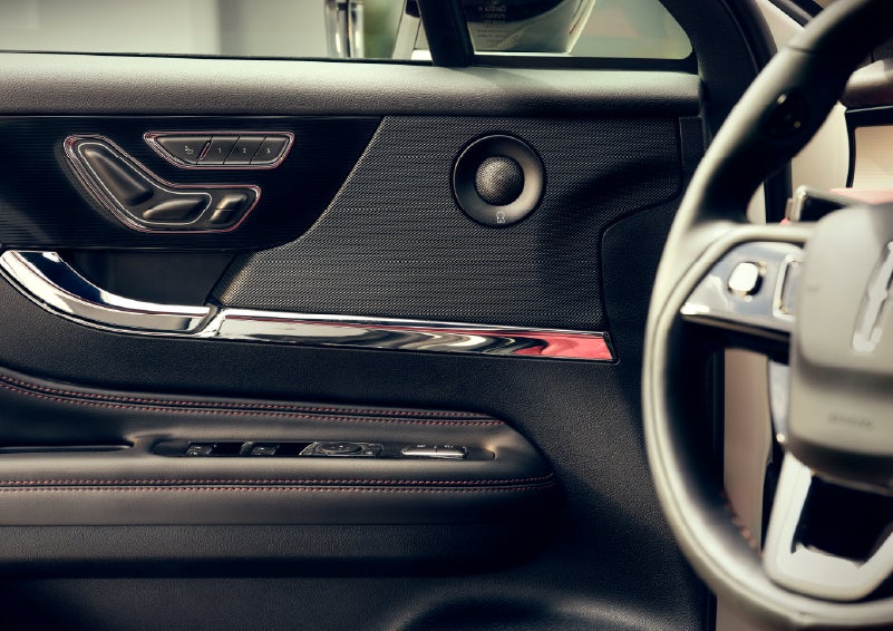An audio speaker is shown in the driver's side door of a 2026 Lincoln Corsair® SUV | Parks Lincoln of Wesley Chapel in Wesley Chapel FL