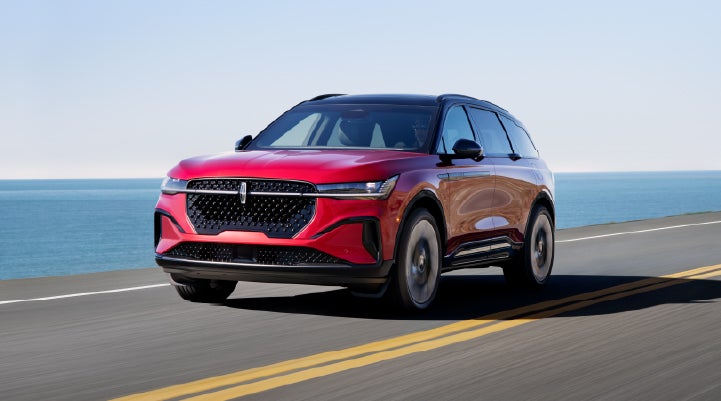 A 2026 Lincoln Nautilus® SUV is being driven on a seaside roadway. | Parks Lincoln of Wesley Chapel in Wesley Chapel FL