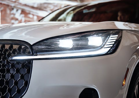 A close-up of a headlamp on the 2027 Lincoln Aviator® SUV is shown. | Parks Lincoln of Wesley Chapel in Wesley Chapel FL