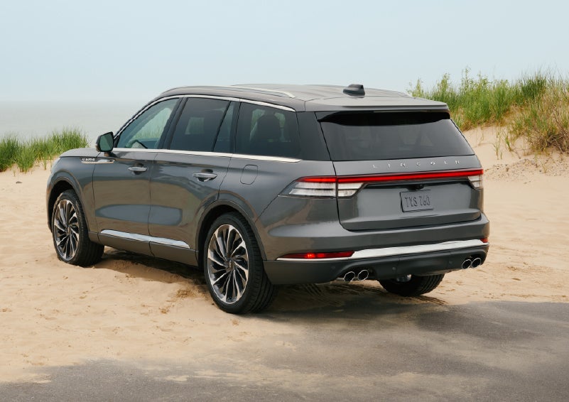 A 2027 Lincoln Aviator® SUV is parked next to sand dunes. | Parks Lincoln of Wesley Chapel in Wesley Chapel FL
