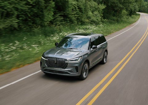A 2027 Lincoln Aviator® SUV is being driven down a road. | Parks Lincoln of Wesley Chapel in Wesley Chapel FL