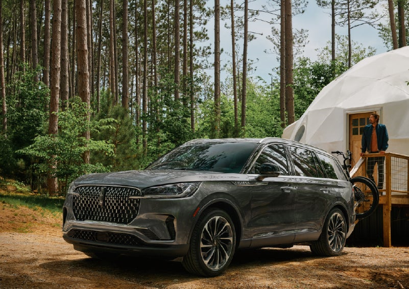 A 2027 Lincoln Aviator® is parked next to a high end glamping site. | Parks Lincoln of Wesley Chapel in Wesley Chapel FL